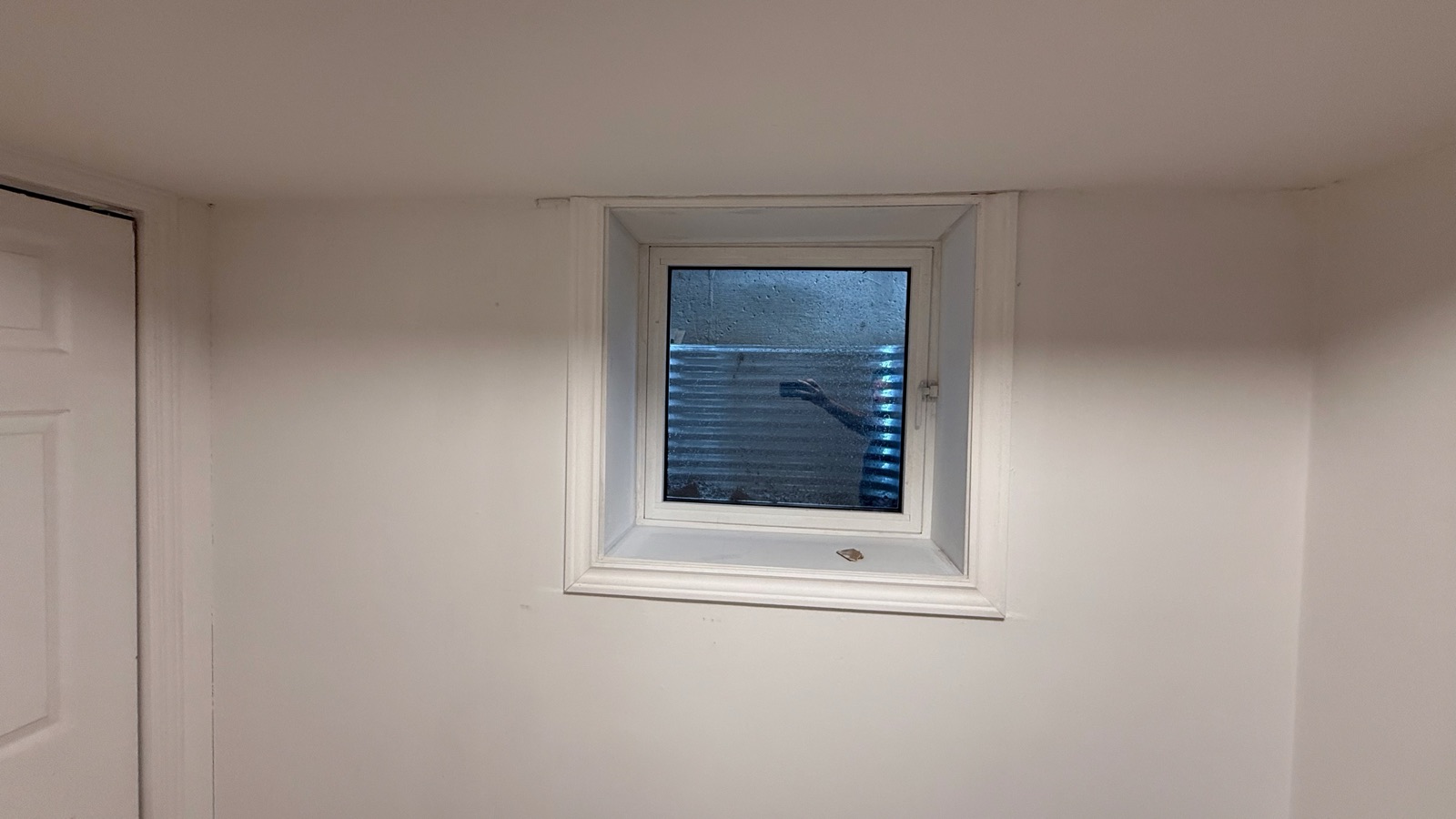 New egress window in a finished basement bedroom