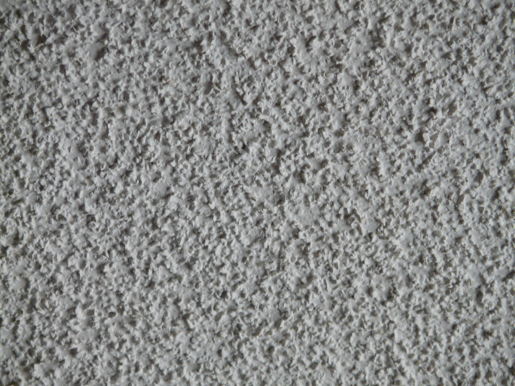 Close-up of a white popcorn ceiling texture